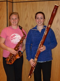 Emily Verschoor-Kirss ’15 (left) and Avery Yurman ’13 pose with their instruments. The two recently participated in the New England Intercollegiate Band Festival at Gordon College.