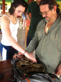 Emma Sherer '13 (left) and Associate Professor of Ethnobotany Manuel Lizarralde check out a six-foot boa constrictor they caught in Belize.