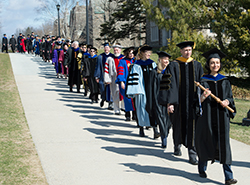 Delegates, wearing the colorful regalia of their institutions, take part in the processional leading Bergeron to Palmer Auditorium for the Inauguration.