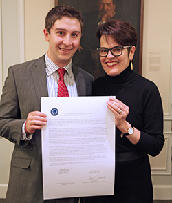 SGA President Evert Fowle '14 (left) and President Katherine Bergeron signed a copy of the College's Shared Governance Covenant in February. The document, which each year reaffirms the College's commitment to shared governance, is also signed by the chairs of the faculty and staff representative bodies.