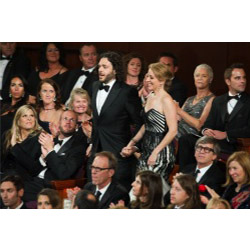 Sean Fine '96 and Andrea Nix Fine head to the stage to accept the Oscar for best documentary short film. Photo credit: Darren Decker/ ©A.M.P.A.S.