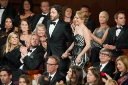 Sean Fine '96 and Andrea Nix Fine head to the stage to accept the Oscar for best documentary short film. Photo credit: Darren Decker/ ©A.M.P.A.S.
