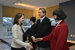 Martina Rudolf ’14 (far left) is congratulated by Diane Y. Williams ’59 and Jim Berrien ’74 at a reception following the weeklong workshop.