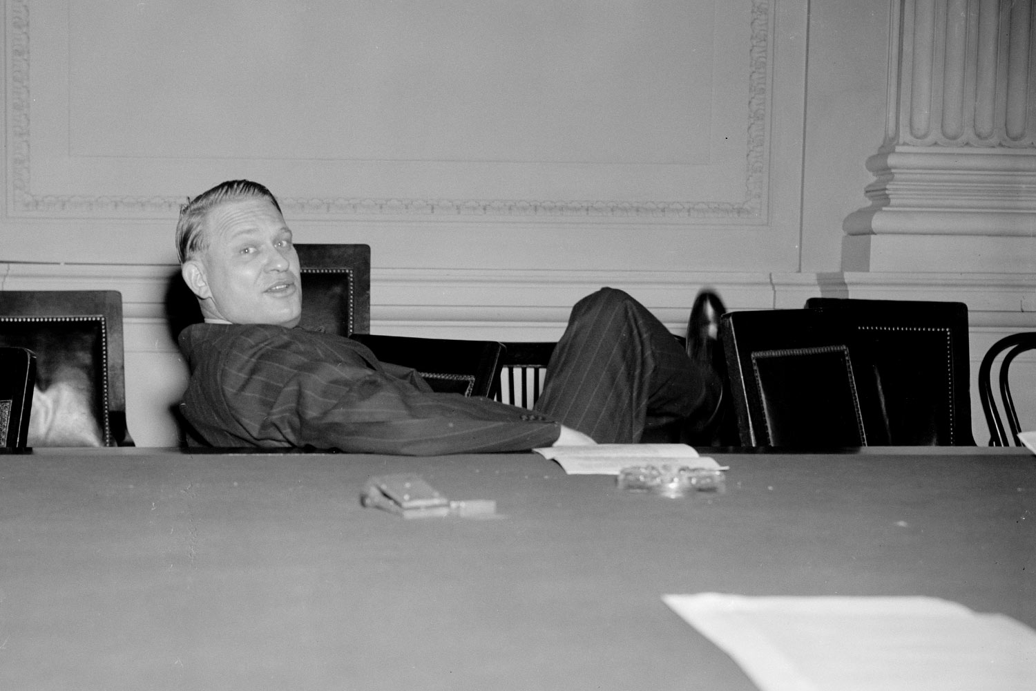 Historic image of New Deal-era writer behind desk