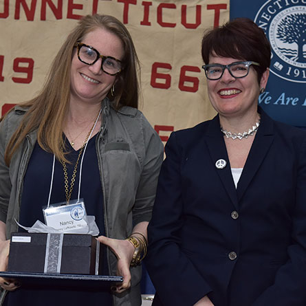 Nancy E. Lefkowitz '92 receives the Agnes Berkeley Leahy Award for outstanding service from President Katherine Bergeron.