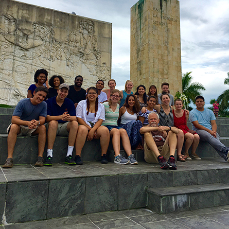 Students who took part in the fall 2016 Study Away Teach Away to Cuba and Mexico sit on the steps of the Che Guevara Mausoleum in Santa Clara, Cuba.
