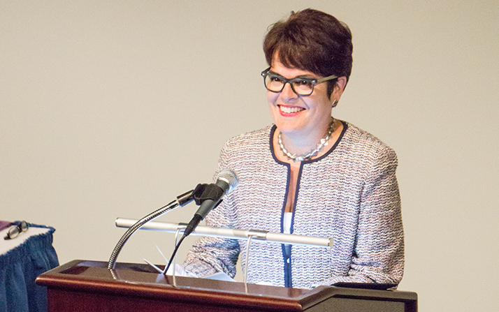 President Katherine Bergeron speaks at a welcome reception for new students