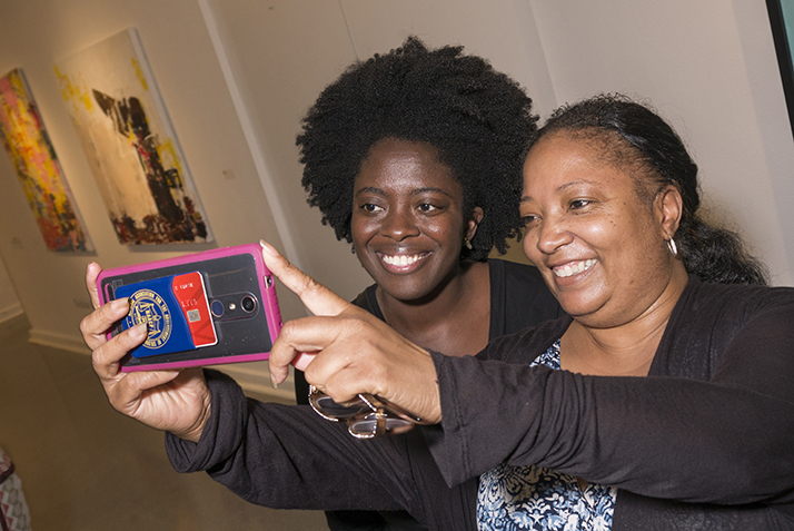 Author Yaa Gyasi poses with a fan for a selfie