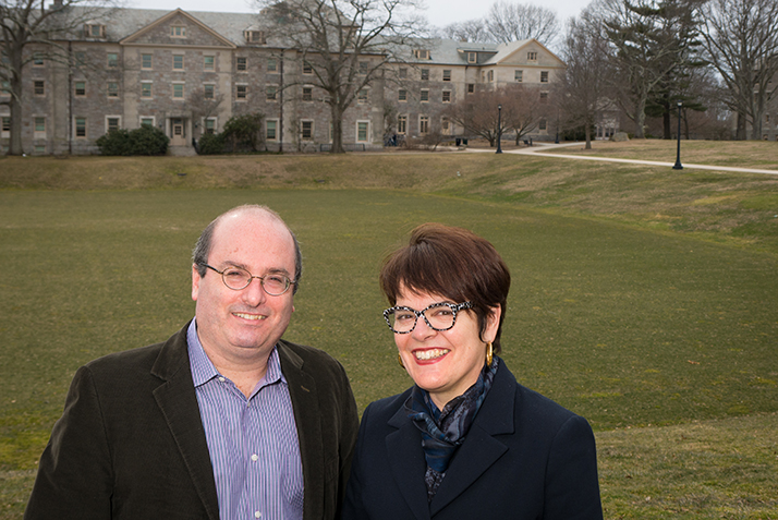 David Grann and President Katherine Bergeron pose in front of the College's Tempel Green.