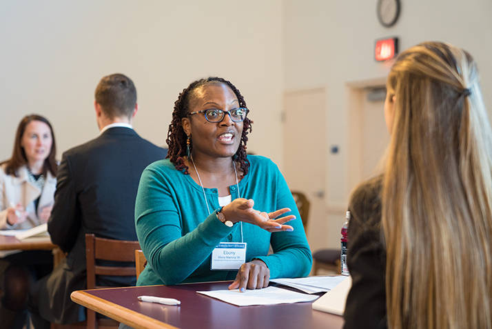 Associate Dean for Equity and Compliance Programs Ebony Manning conducts a mock interview with Piper Baine '21. 