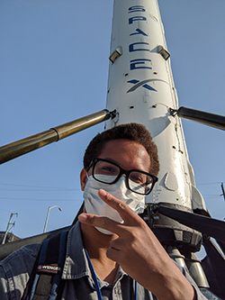 Cameron Aaron '21 poses in front of SpaceX
