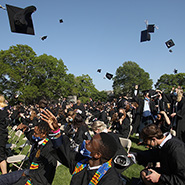 Graduates toss their caps