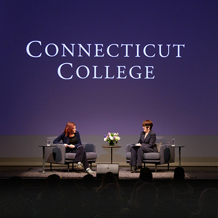 Rosanne Cash and President Katherine Bergeron on stage in the Athey Center for Performance and Research.