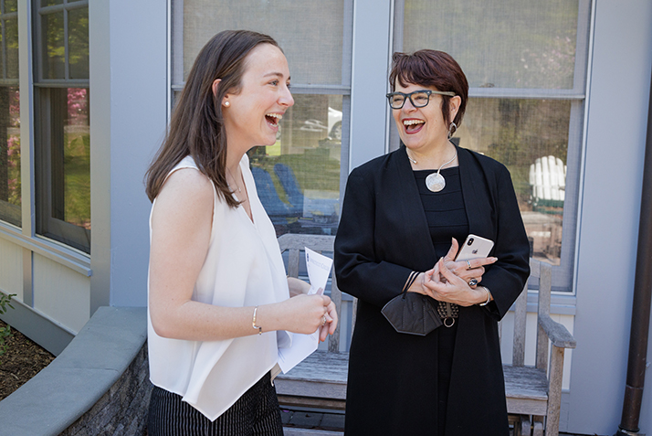 President Katherine Bergeron, right, and Ashlyn Healy '20 share a laugh.