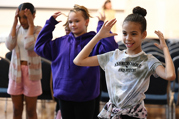 Fifth graders from the Regional Multicultural Magnet School in New London pantomime “Head, Shoulders, Knees, and Toes” in French during World Languages Day