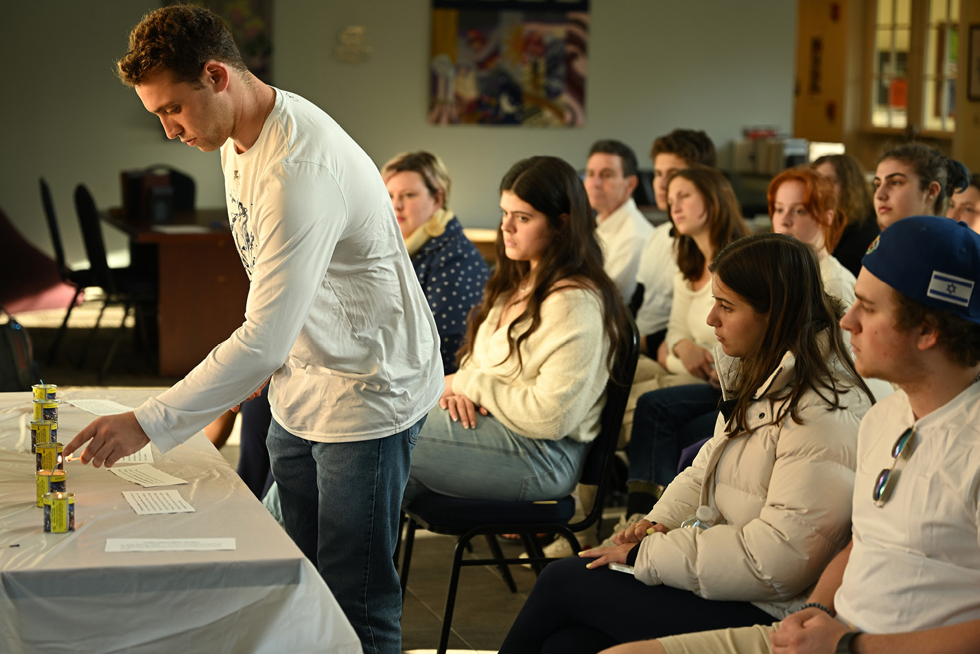 The lighting of six Yahrzeit candles at Zachs Hillel House representing the six-million jews slaughtered in the Holocaust as part of the Six Million Steps for Six Million Lives international effort led by the Israeli-American Council Tuesday, April 18, 2023.