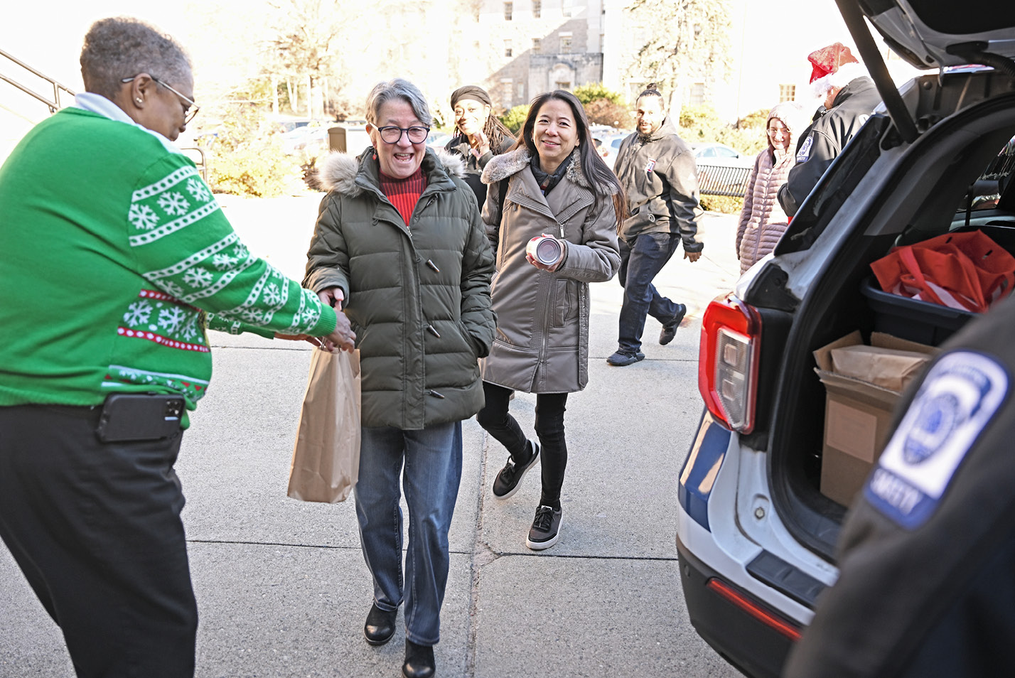 Mary Savage, director of campus safety, collects food for the Gemma E. Moran United Way/Labor Food Center.