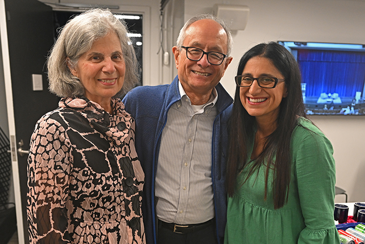 Interim President Les Wong and his wife Phyllis Michael Wong pose for a photo with Mona Hanna-Attisha.