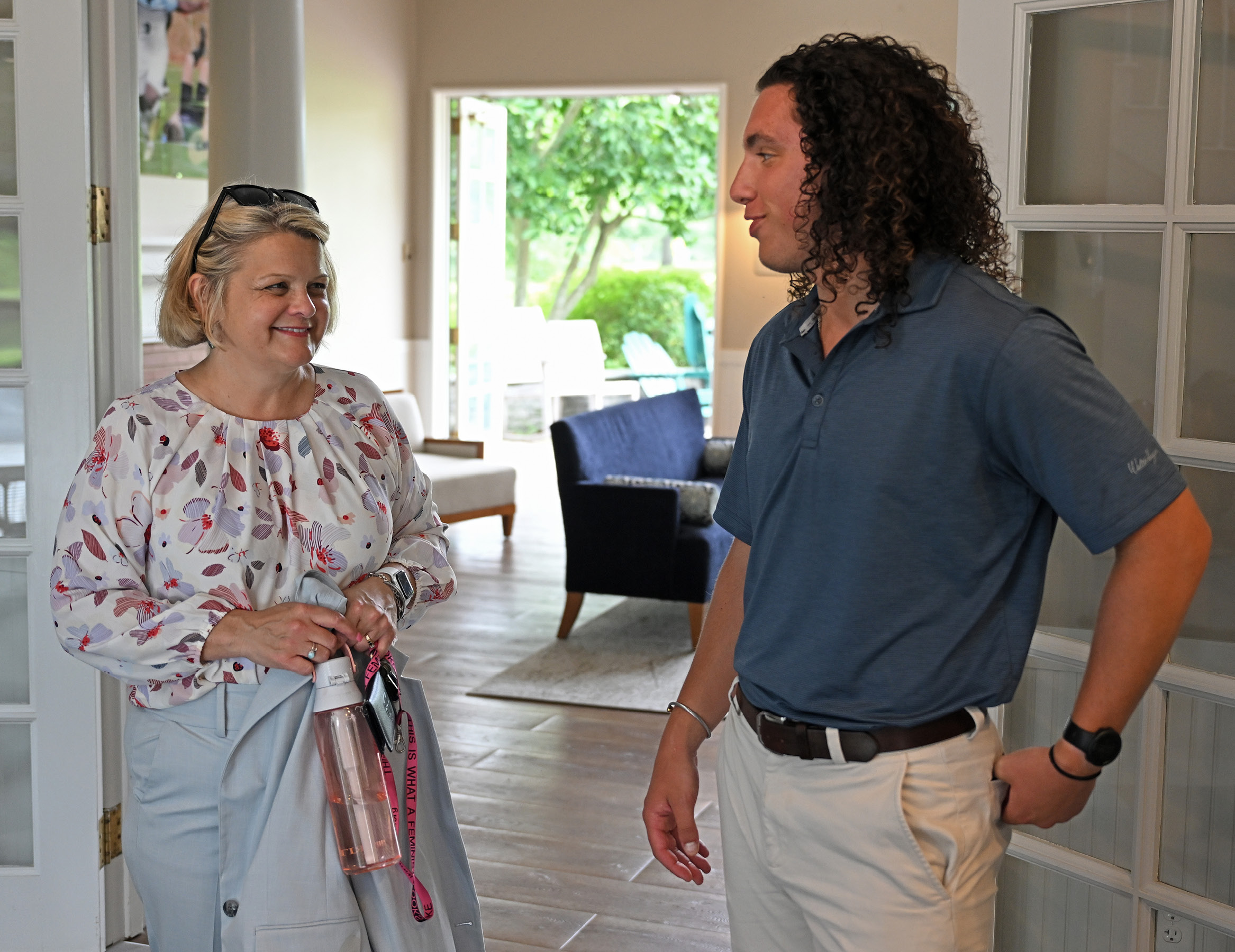 President Andrea Chapdelaine meets with a staff member during a tour of campus on her first day.
