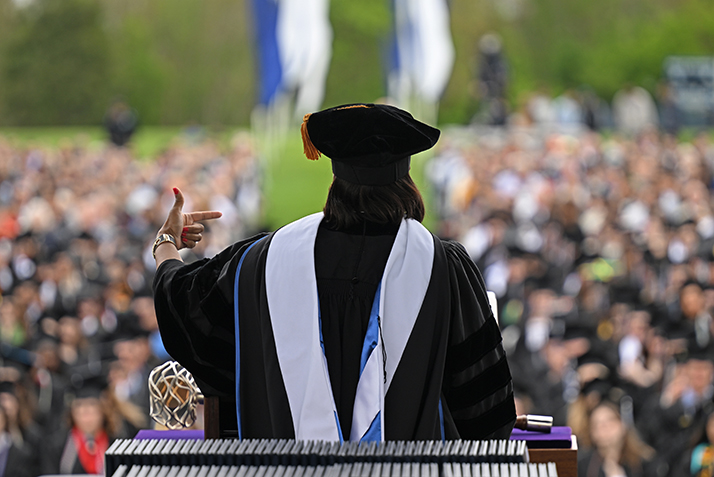 A speaker addresses a sea of graduates during commencement extercises
