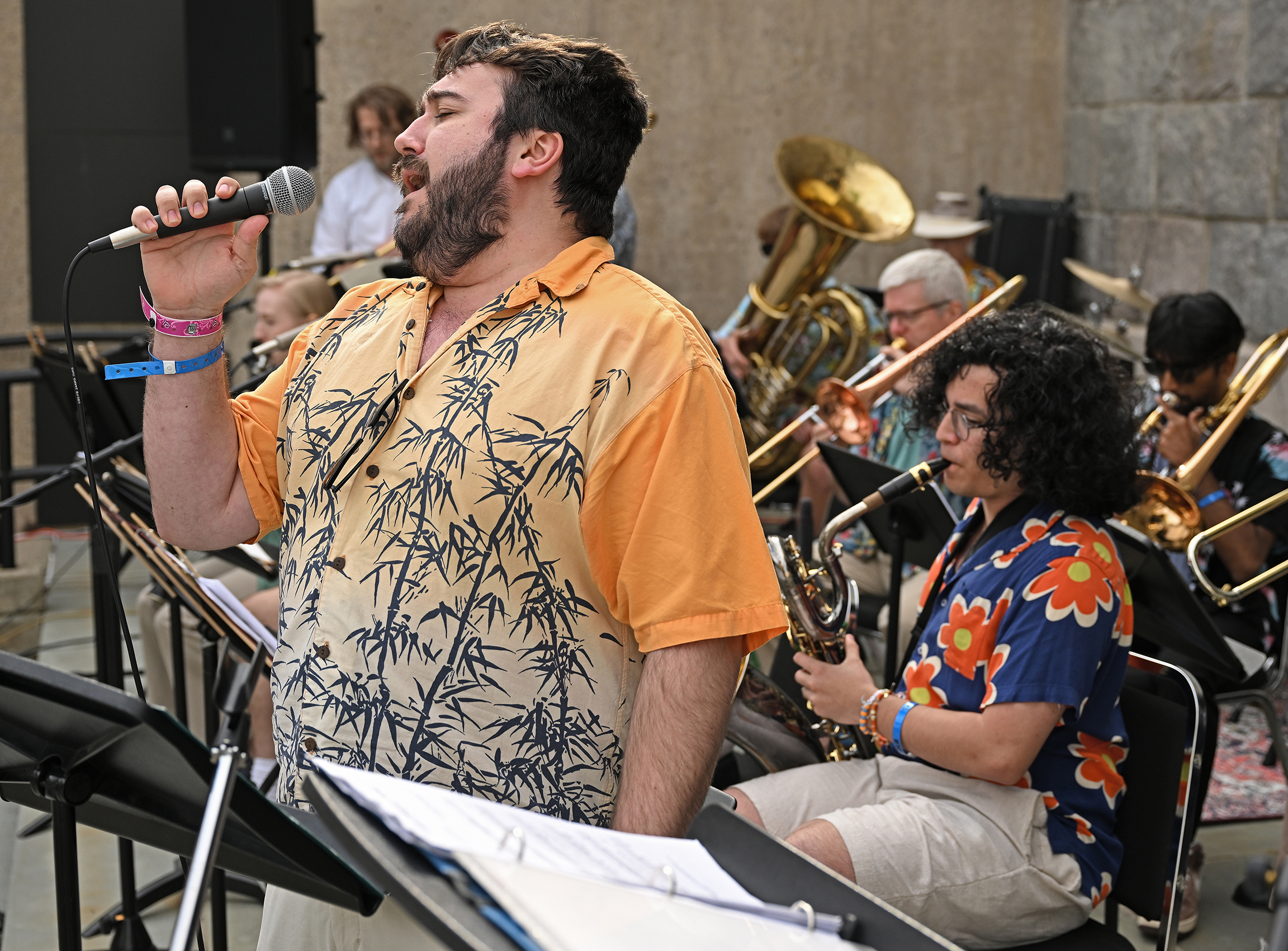 A student vocalist performs with a jazz ensemble.