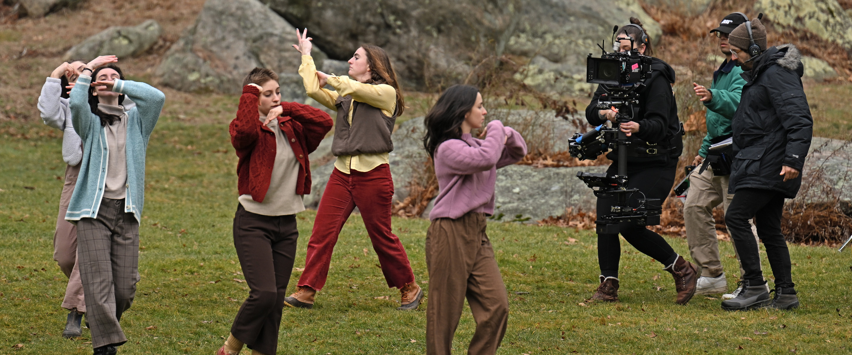 Dance students perform for the camera in the Connecticut College Arboretum.