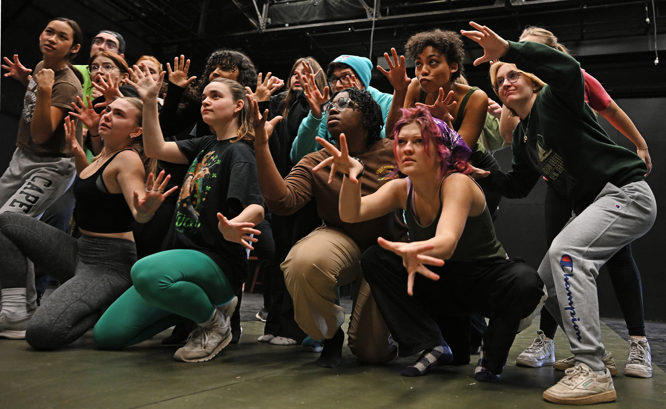 The cast of the Conn College theater department production of Urinetown rehearse the opening number choreography.