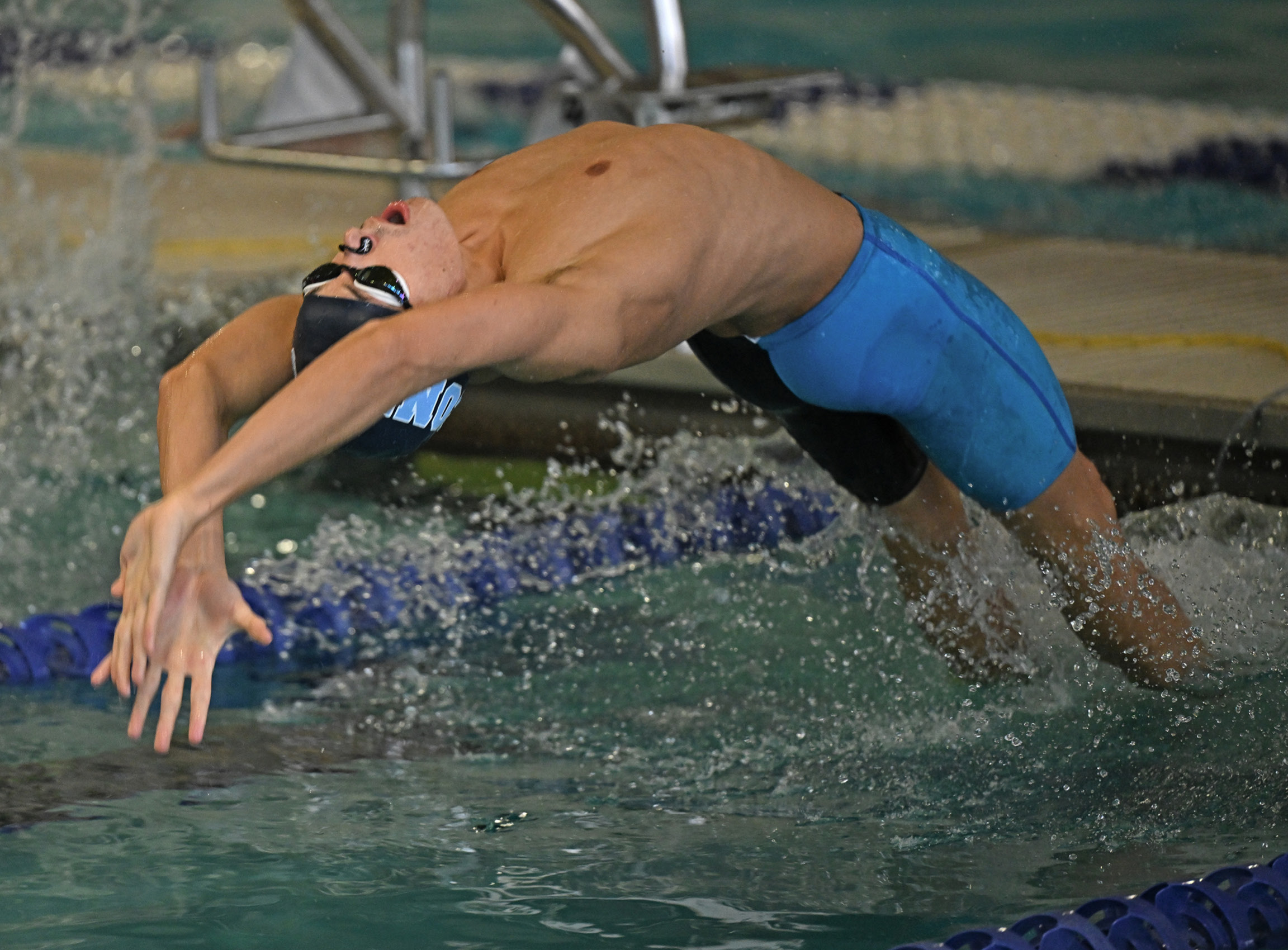 Tyler Choedak ’27 competes in the 100 yard backstroke vs. Williams College