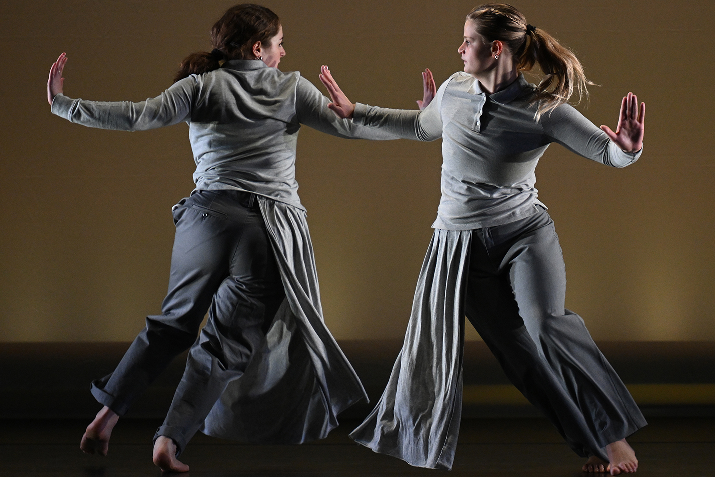 two dancers perform a duet