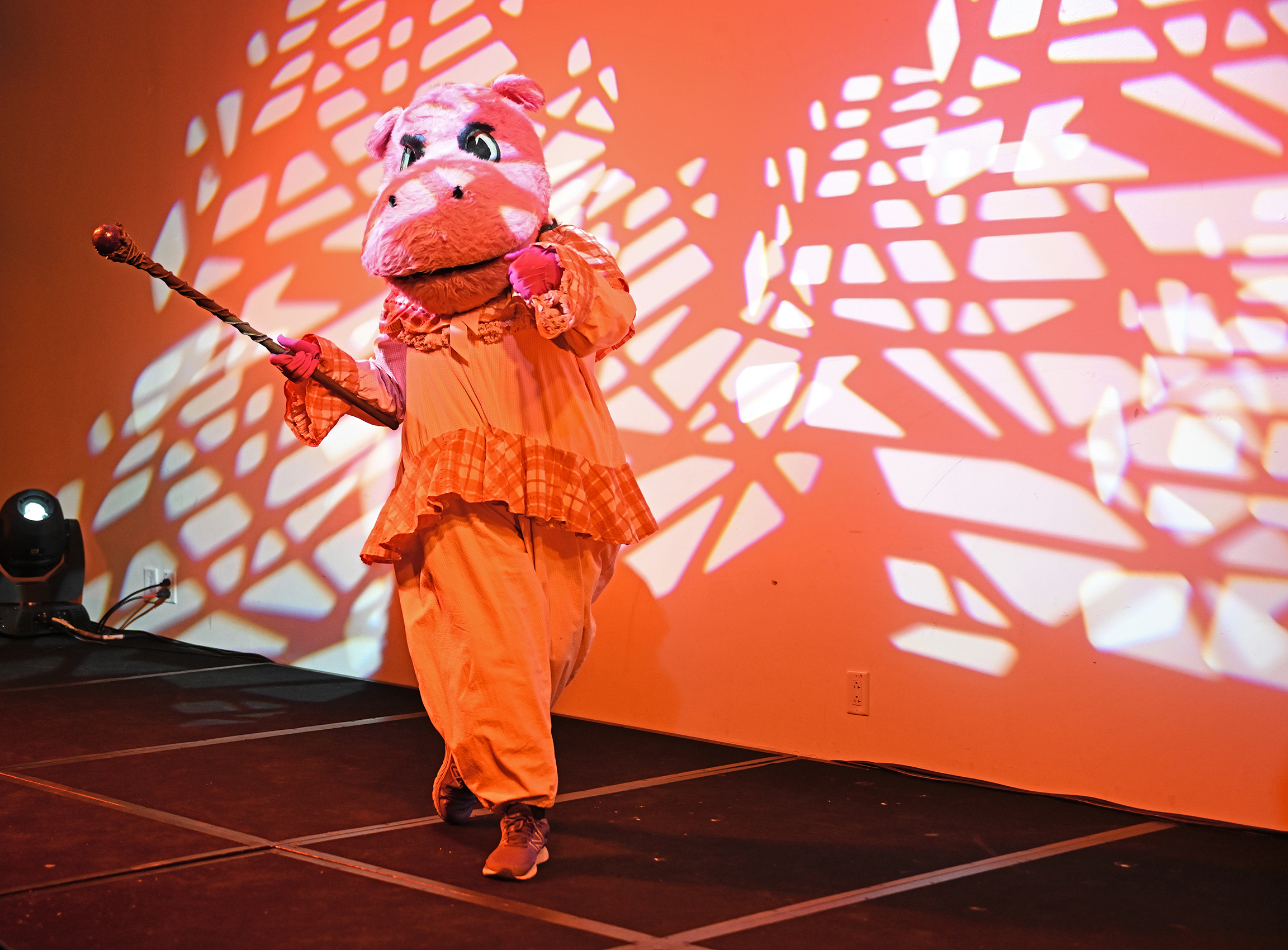 Student in hippo costume dancing on stage