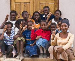 Children pose outside of the Chikumbuso school.
