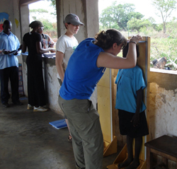 Brigid O'Gorman '11 records a child's height at the Asayo's Wish Orphanage in Kaberamaido, Uganda, <br>in 2009.<br><br>