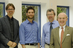 Professors Timo Ovaska, Simon Feldman and Robert Askins pose with President Leo I. Higdon Jr.