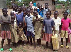 Brigid O´Gorman ´11, center, poses with children during a medical mission to Kaberamaido, Uganda