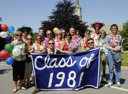 The Class of 1981, celebrating its 30th reunion, pauses for a photo at the start of the parade.