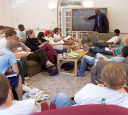 Professor David Canton leads a freshman seminar in a residence house common room.
