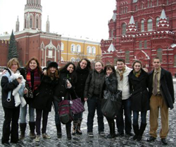Professor Andrea Lanoux (far left, holding 9-month-old Scarlett), poses with students in Russia.
