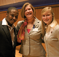 Dean Martha Merrill, center, poses with students after a campus event.
