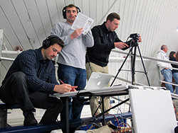 Gordon Donnelly ’16, Steven Victor ’15 and Patrick Leary ’15 live broadcast a women's ice hockey game against Trinity. Photo by Grace Griffin ’14.