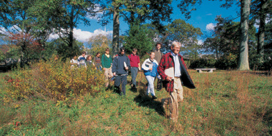 The late Professor William Niering leads students through the Arboretum.